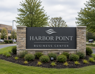 Custom monument sign at the entrance of a commercial property on Long Island, New York.